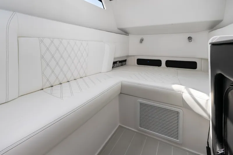 Slide: The Image of Luxurious interior of 2024 Nor-Tech 450 Sport boat with white seating and modern design. - 29