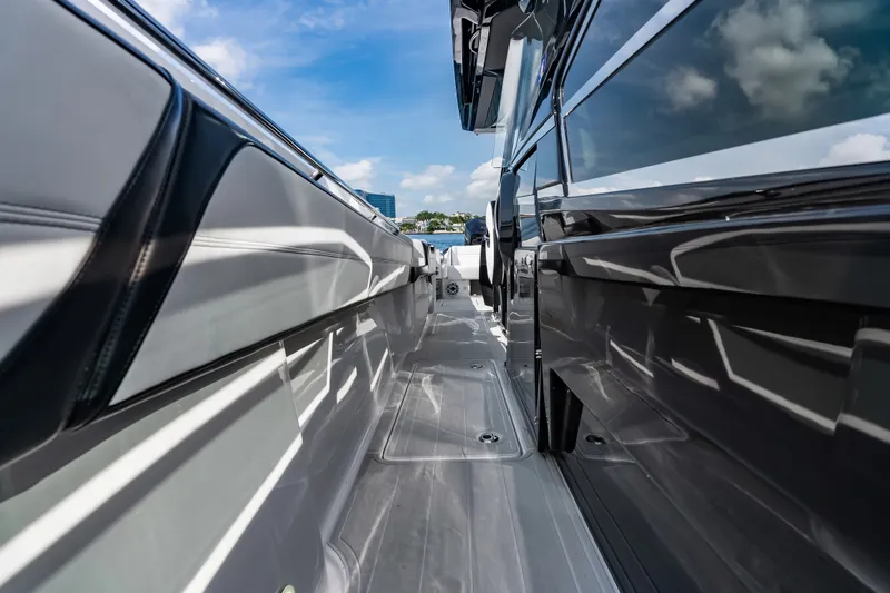 Slide: The Image of 2024 Nor-Tech 450 Sport boat deck with sleek design and modern features. - 46