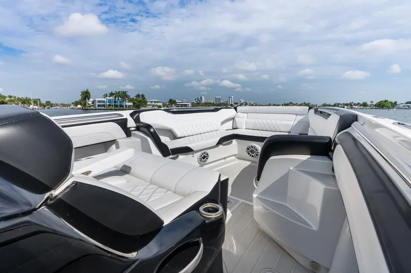 Slide: The Image of Luxurious seating on 2024 Nor-Tech 450 Sport boat, featuring sleek design and waterfront view. - 34