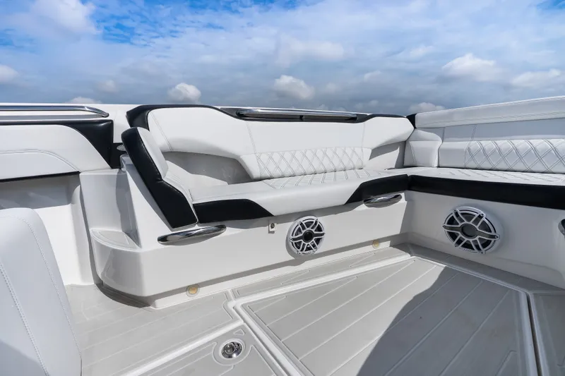 Slide: The Image of Luxurious seating on 2024 Nor-Tech 450 Sport boat under a clear blue sky. - 42