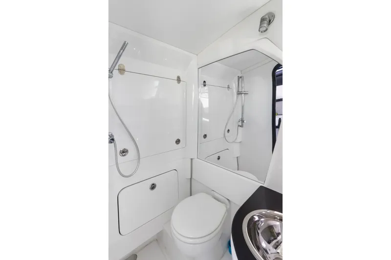 Slide: The Image of 2024 Nor-Tech 450 Sport boat bathroom with modern fixtures and sleek design. - 33