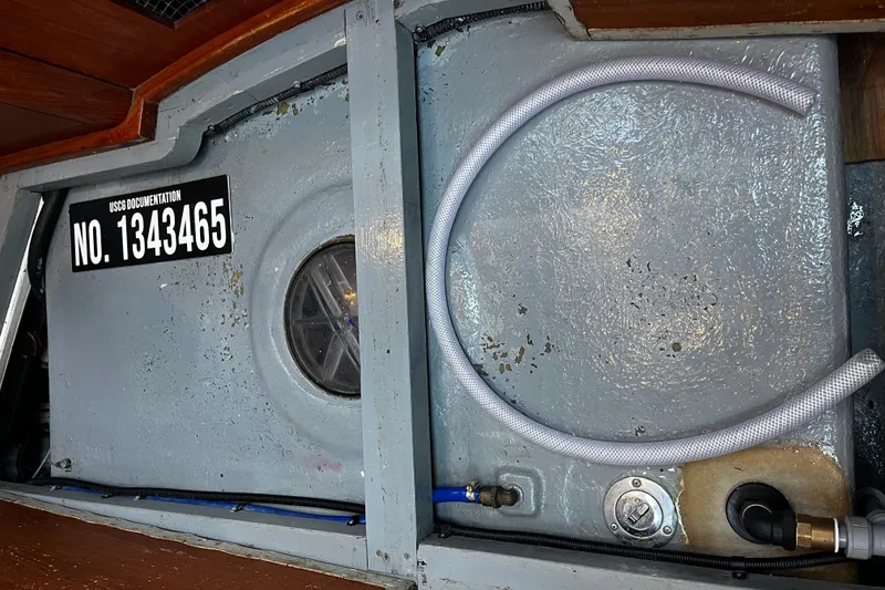 Slide: The Image of Interior view of 1999 Oyster 53 Deck Saloon with USCG documentation number. - 58