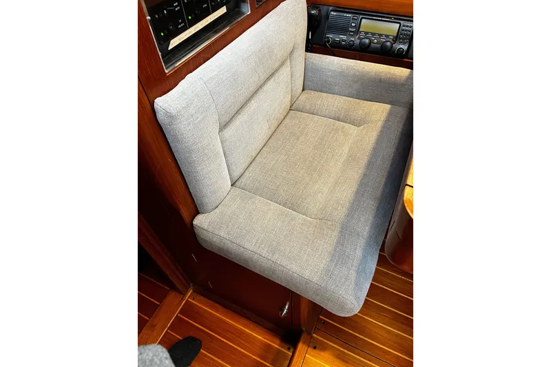 Slide: The Image of Gray cushioned seat in 1999 Oyster 53 Deck Saloon yacht interior. - 37