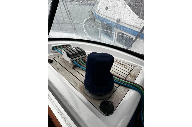 Slide: The Image of Deck of 1999 Oyster 53 Deck Saloon with winch and colorful ropes. - 73