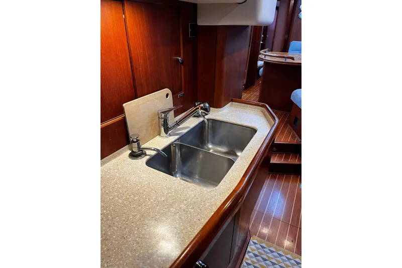 Slide: The Image of Luxurious kitchen sink area on 1999 Oyster 53 Deck Saloon yacht. - 43