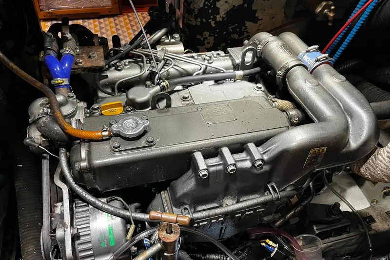 Slide: The Image of Engine of a 1999 Oyster 53 Deck Saloon yacht, showcasing intricate mechanical components. - 55