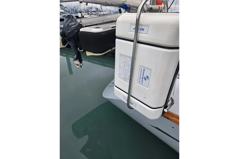 Slide: The Image of 1999 Oyster 53 Deck Saloon yacht with Yamaha outboard motor and Ocean Safety equipment. - 70