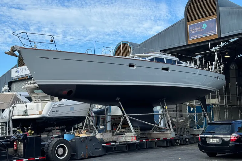 Slide: The Image of Oyster 53 Deck Saloon yacht from 1999 on a trailer at a marina. - 87