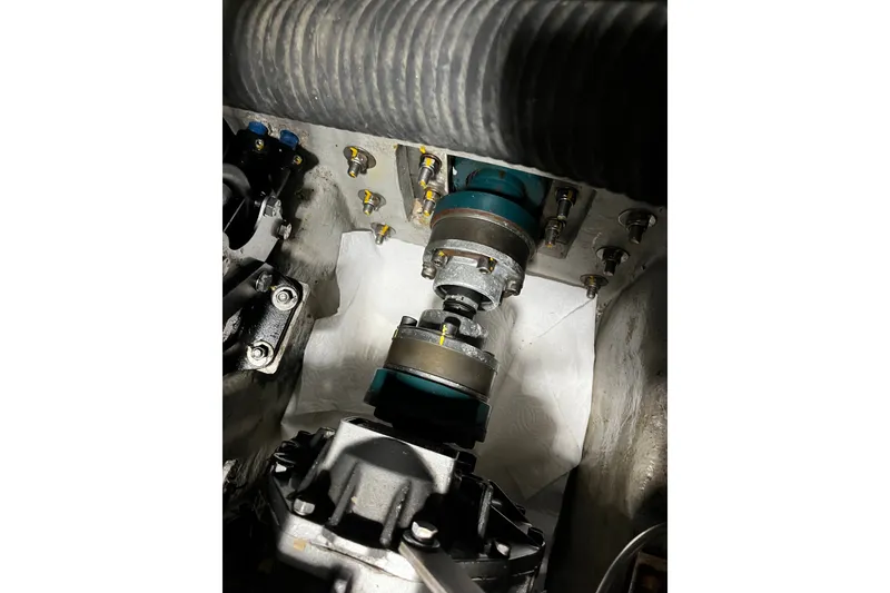 Slide: The Image of Engine compartment of a 1999 Oyster 53 Deck Saloon yacht, showcasing mechanical components. - 62