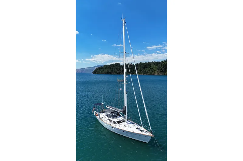 Slide: The Image of Sailing yacht Oyster 53 Deck Saloon, 1999, anchored in serene blue waters. - 85