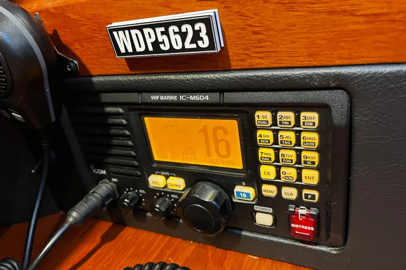 Slide: The Image of VHF marine radio on 1999 Oyster 53 Deck Saloon yacht, displaying channel 16. - 50