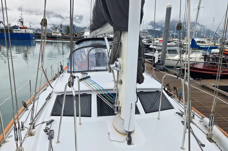 Slide: The Image of Sailboat deck view of 1999 Oyster 53 Deck Saloon in a marina setting. - 67