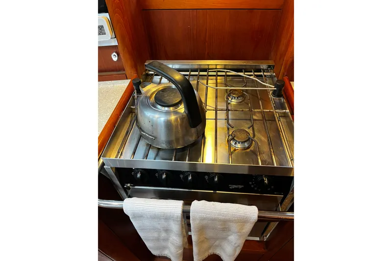 Slide: The Image of Stainless steel stove with kettle in 1999 Oyster 53 Deck Saloon yacht kitchen. - 42