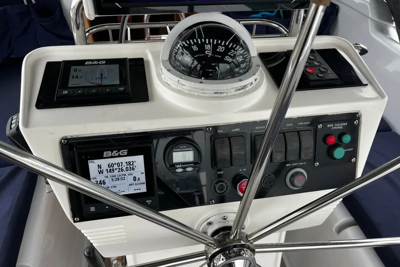 Slide: The Image of Control panel of a 1999 Oyster 53 Deck Saloon yacht with navigation instruments. - 78