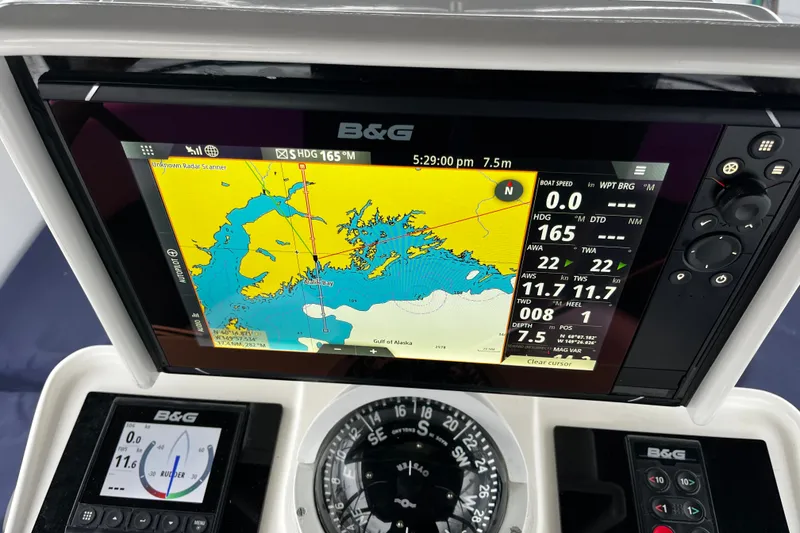 Slide: The Image of Navigation system on a 1999 Oyster 53 Deck Saloon, displaying nautical charts and data. - 80