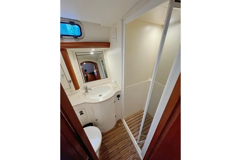 Slide: The Image of Bathroom interior of 1999 Oyster 53 Deck Saloon yacht, featuring shower and sink. - 30