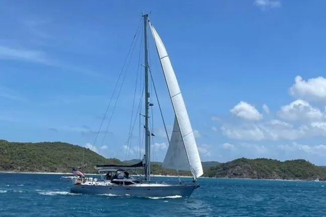 Slide: The Image of Sailing yacht Oyster 53 Deck Saloon, 1999, cruising in clear blue waters. - 86