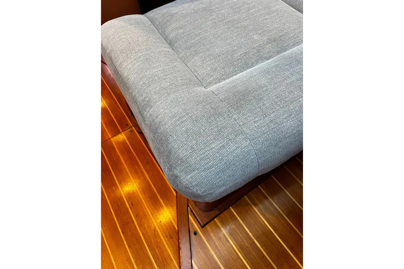 Slide: The Image of Gray cushioned seating on wooden floor of 1999 Oyster 53 Deck Saloon yacht. - 36