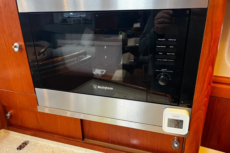 Slide: The Image of Westinghouse microwave in 1999 Oyster 53 Deck Saloon yacht kitchen, with digital timer. - 41