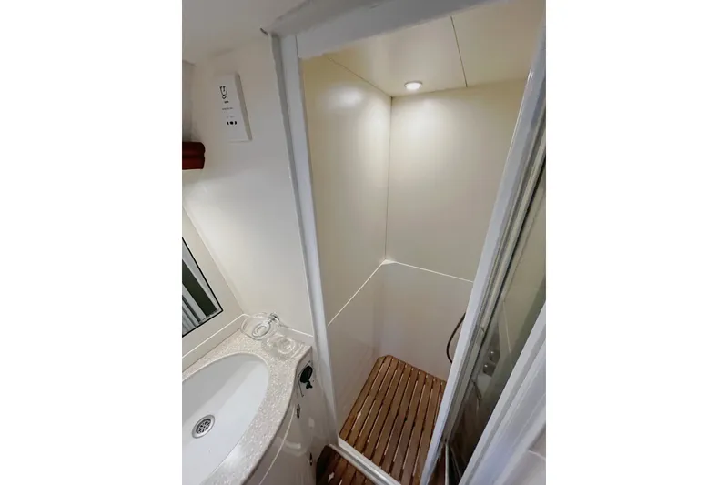 Slide: The Image of Bathroom interior of 1999 Oyster 53 Deck Saloon yacht with shower and sink. - 31