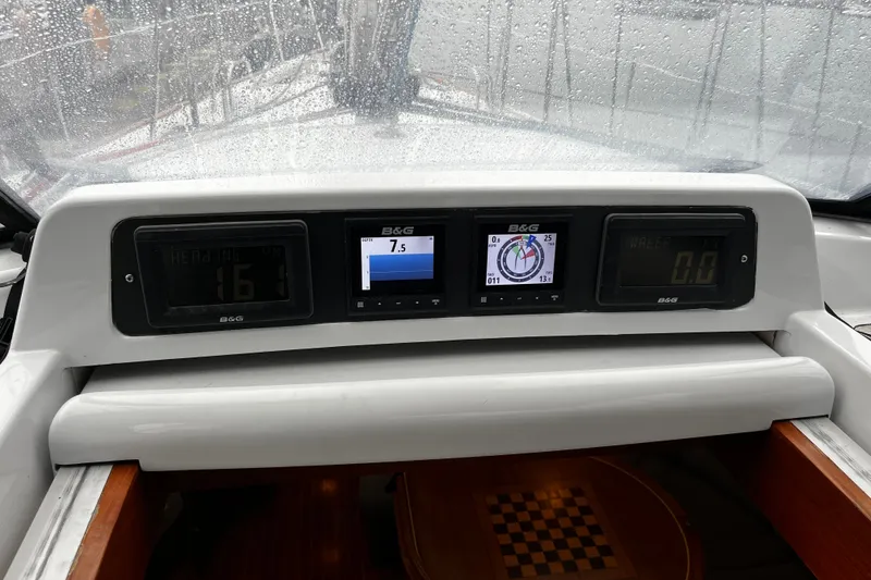 Slide: The Image of Cockpit instruments on a 1999 Oyster 53 Deck Saloon yacht in rainy weather. - 74