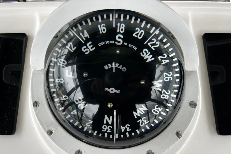 Slide: The Image of Close-up of a nautical compass on a 1999 Oyster 53 Deck Saloon yacht. - 81
