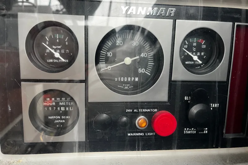Slide: The Image of Yanmar engine control panel on 1999 Oyster 53 Deck Saloon, displaying gauges and indicators. - 56