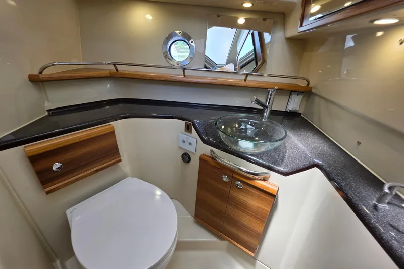 Slide: The Image of Luxurious bathroom in 2026 Ranger Tugs R-29 CB with modern fixtures and elegant design. - 11