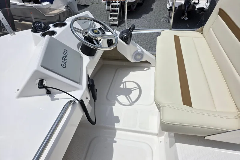 Slide: The Image of Helm of 2026 Ranger Tugs R-29 CB with Garmin navigation system and seating. - 3