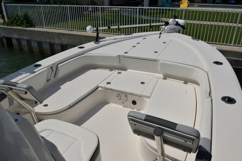 Slide: The Image of 2023 Robalo 246 Cayman boat interior with seating and storage compartments. - 30
