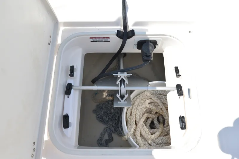 Slide: The Image of Anchor storage compartment on 2023 Robalo 246 Cayman boat with rope and chain. - 37