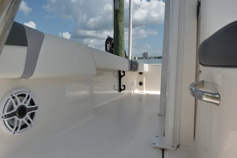 Slide: The Image of 2023 Robalo 246 Cayman boat interior with speaker, sleek design, and ocean view. - 39