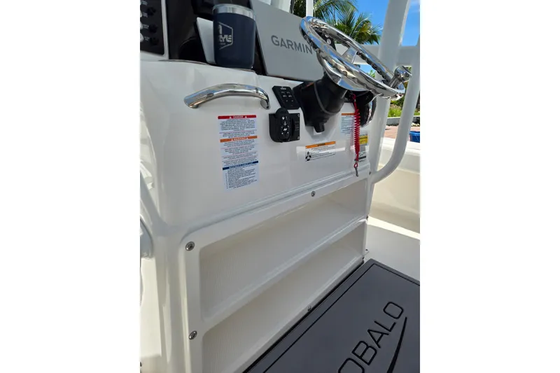 Slide: The Image of 2023 Robalo 246 Cayman boat console with Garmin system and steering wheel. - 45