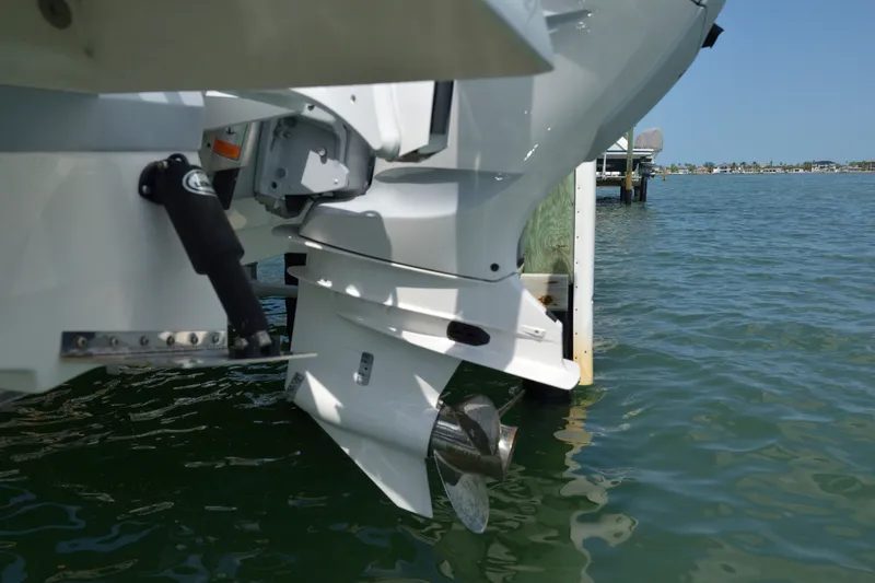 Slide: The Image of 2023 Robalo 246 Cayman boat engine and propeller in water. - 9