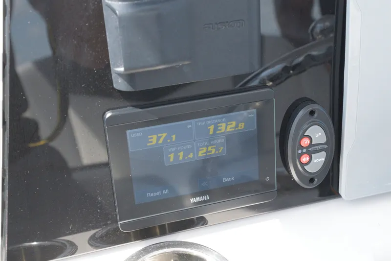 Slide: The Image of Yamaha display on 2023 Robalo 246 Cayman showing fuel usage and trip data. - 15