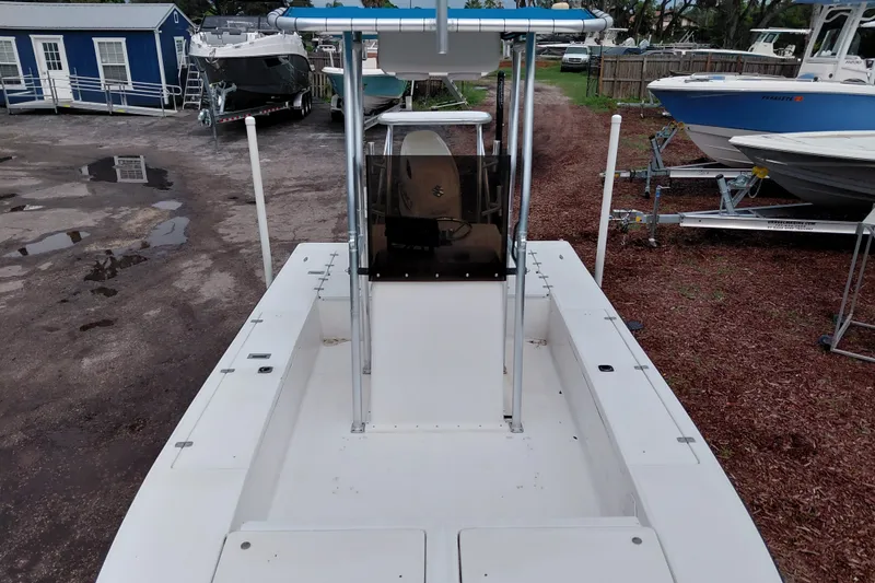 Slide: The Image of Eagle 21 boat from 2000, docked with other vessels in a marina. - 21