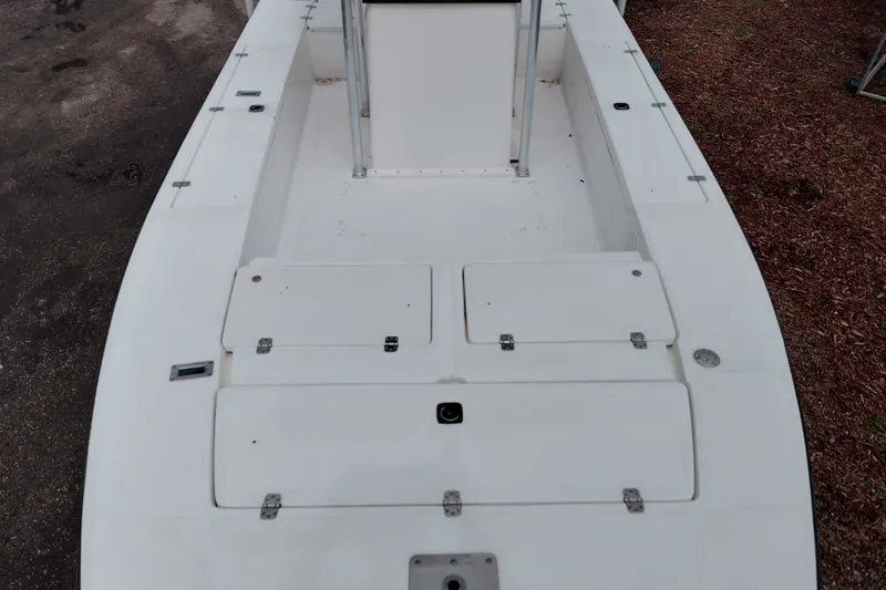 Slide: The Image of 2000 Eagle 21 boat deck with storage compartments and clean white surface. - 20