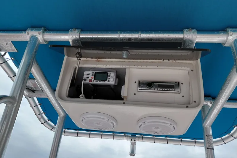 Slide: The Image of Boat electronics panel with radio and speakers on a 2000 Eagle 21 model. - 26