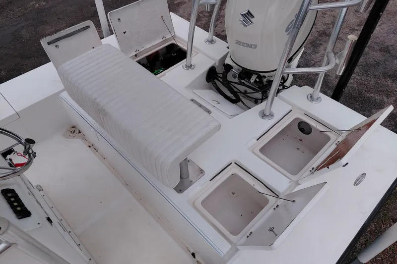 Slide: The Image of Eagle 21 boat interior with storage compartments and Suzuki 200 engine, year 2000 model. - 15