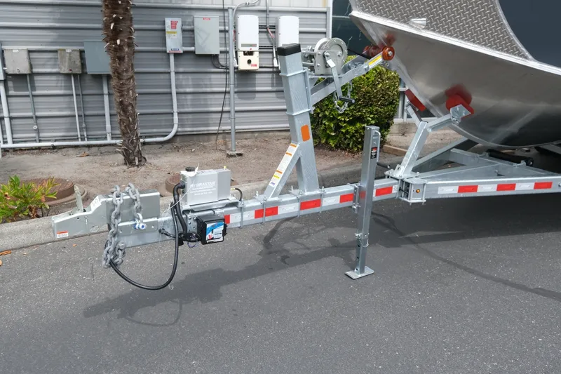 Slide: The Image of Trailer hitch of a 2026 Hewescraft 250 Alaskan boat, parked on asphalt. - 21