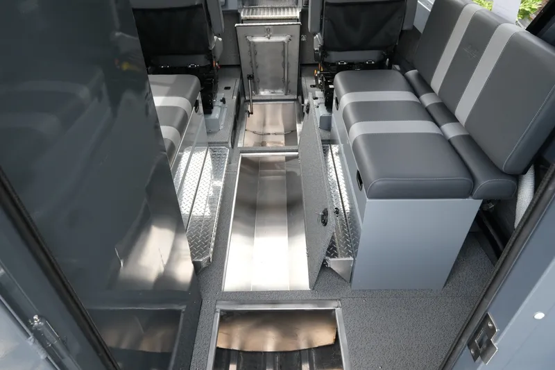 Slide: The Image of Interior of 2026 Hewescraft 250 Alaskan boat with seating and storage compartments. - 15