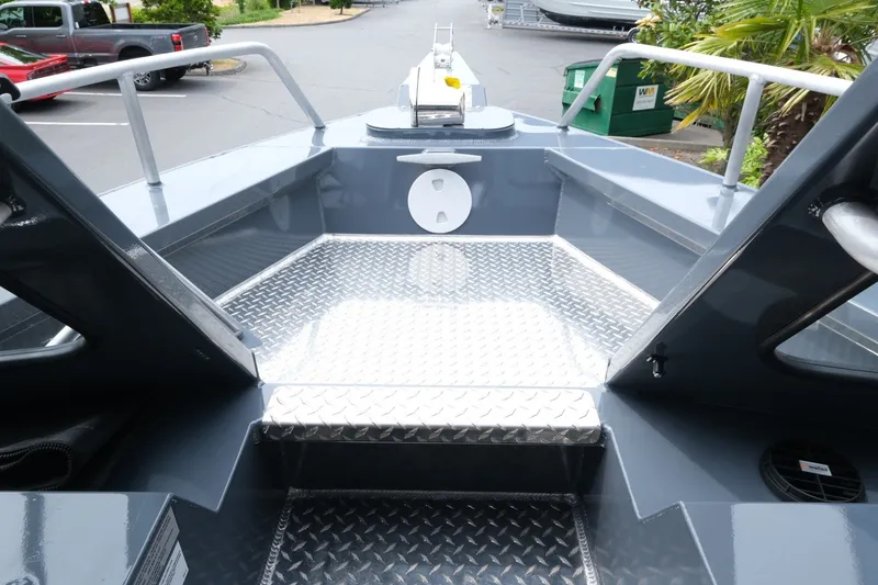 Slide: The Image of 2026 Hewescraft 250 Alaskan boat interior with diamond plate flooring and sleek design. - 14