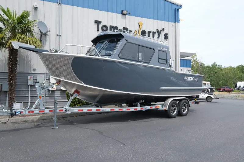 The Image of 2026 Hewescraft 250 Alaskan boat on trailer outside dealership. - 1