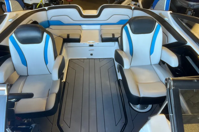 Slide: The Image of 2019 Yamaha Boats 212X interior with sleek seating and modern design. - 8