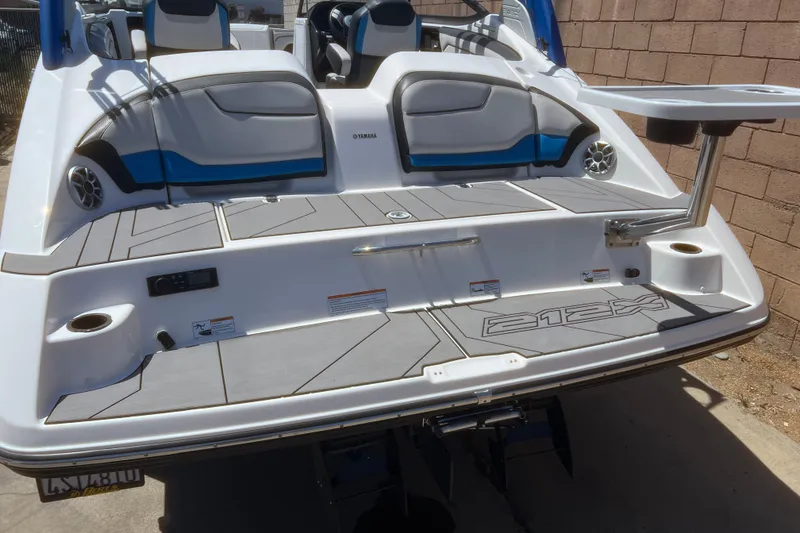 Slide: The Image of 2019 Yamaha Boats 212X rear view with seating and swim platform. - 16