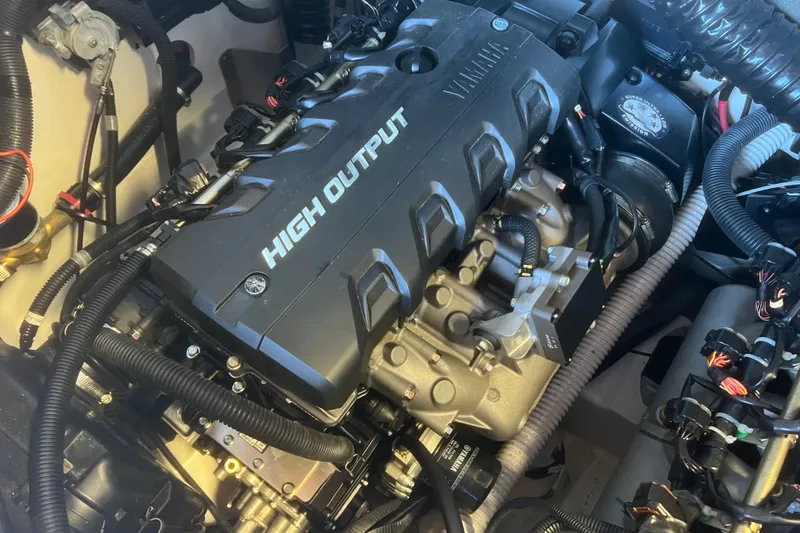 Slide: The Image of High output engine of 2019 Yamaha Boats 212X, showcasing intricate mechanical components. - 13