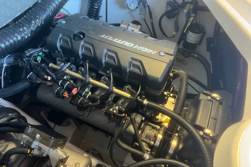 Slide: The Image of 2019 Yamaha Boats 212X engine compartment showcasing high output engine components. - 14