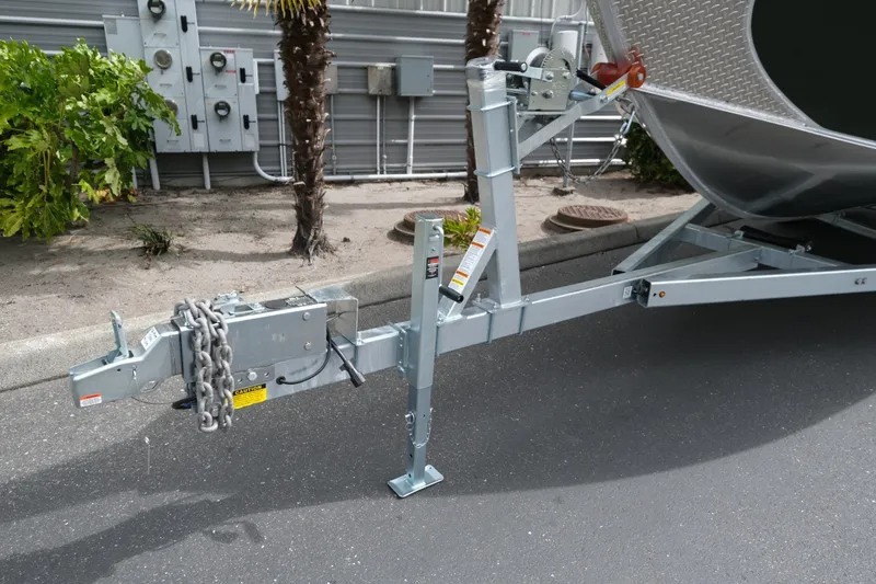 Slide: The Image of Trailer hitch of 2026 Hewescraft 240 Ocean Pro ET Hardtop boat on pavement. - 17
