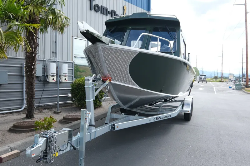 Slide: The Image of 2026 Hewescraft 240 Ocean Pro ET Hardtop boat on trailer, parked outdoors. - 3