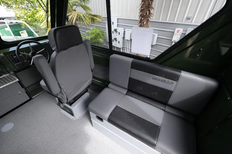 Slide: The Image of Interior of 2026 Hewescraft 240 Ocean Pro ET Hardtop, featuring seating and steering area. - 11